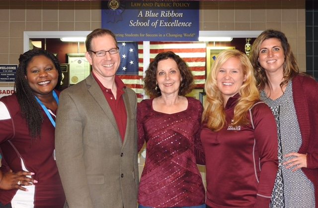 From left: THS Assistant Principals Abby Ajileye and John Stevens, Pegues, Principal Charlene DiMino, Assistant Principal Joslyn Travis